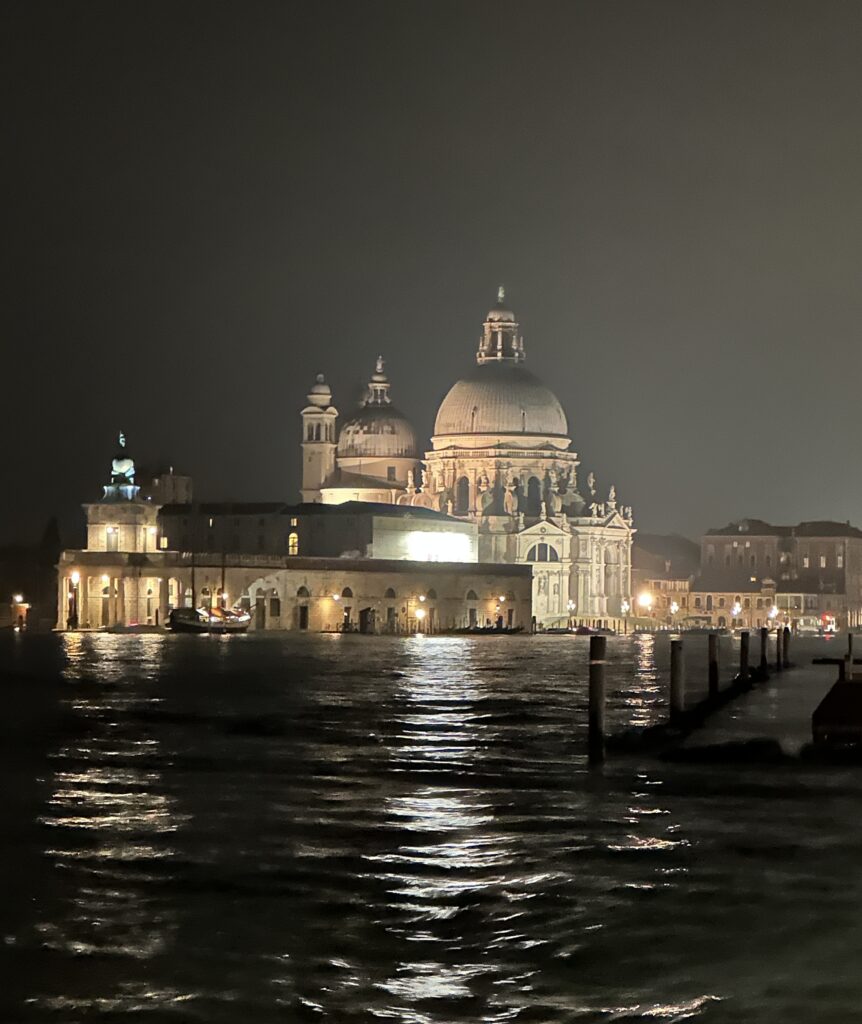 Night time view of the Basilica Santa Maria della Salute, Venice from across the water. 